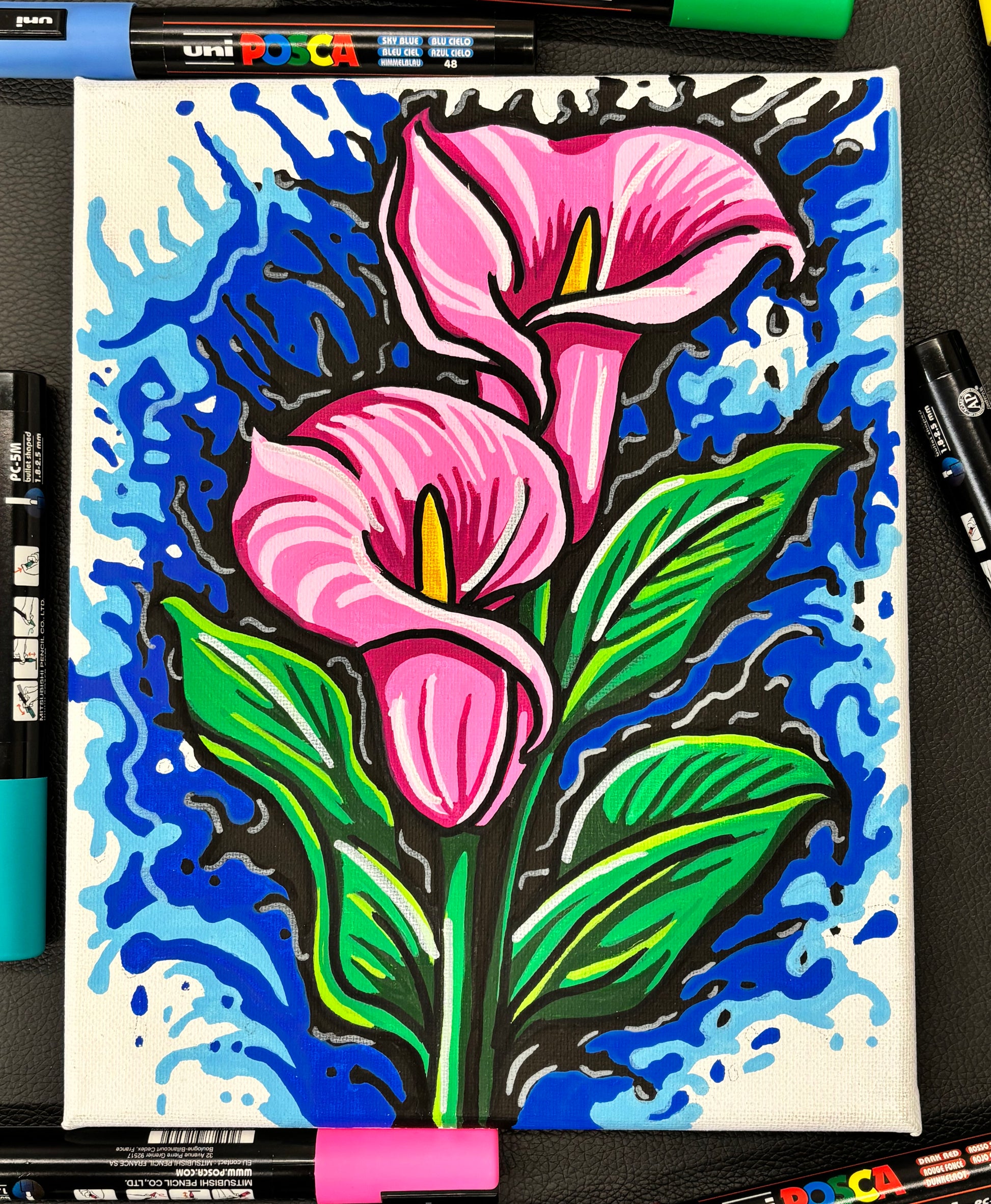 Colorful drawing of pink calla lillies on a blue background with Uni Posca markers.