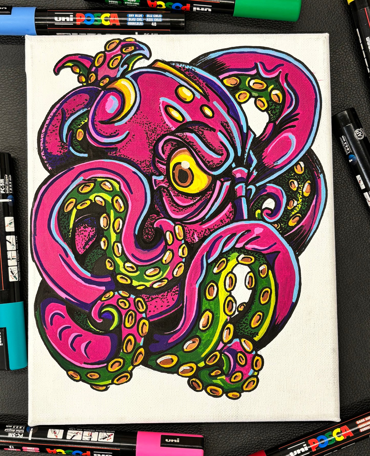 abstract colorful painting of an octopus with markers in background